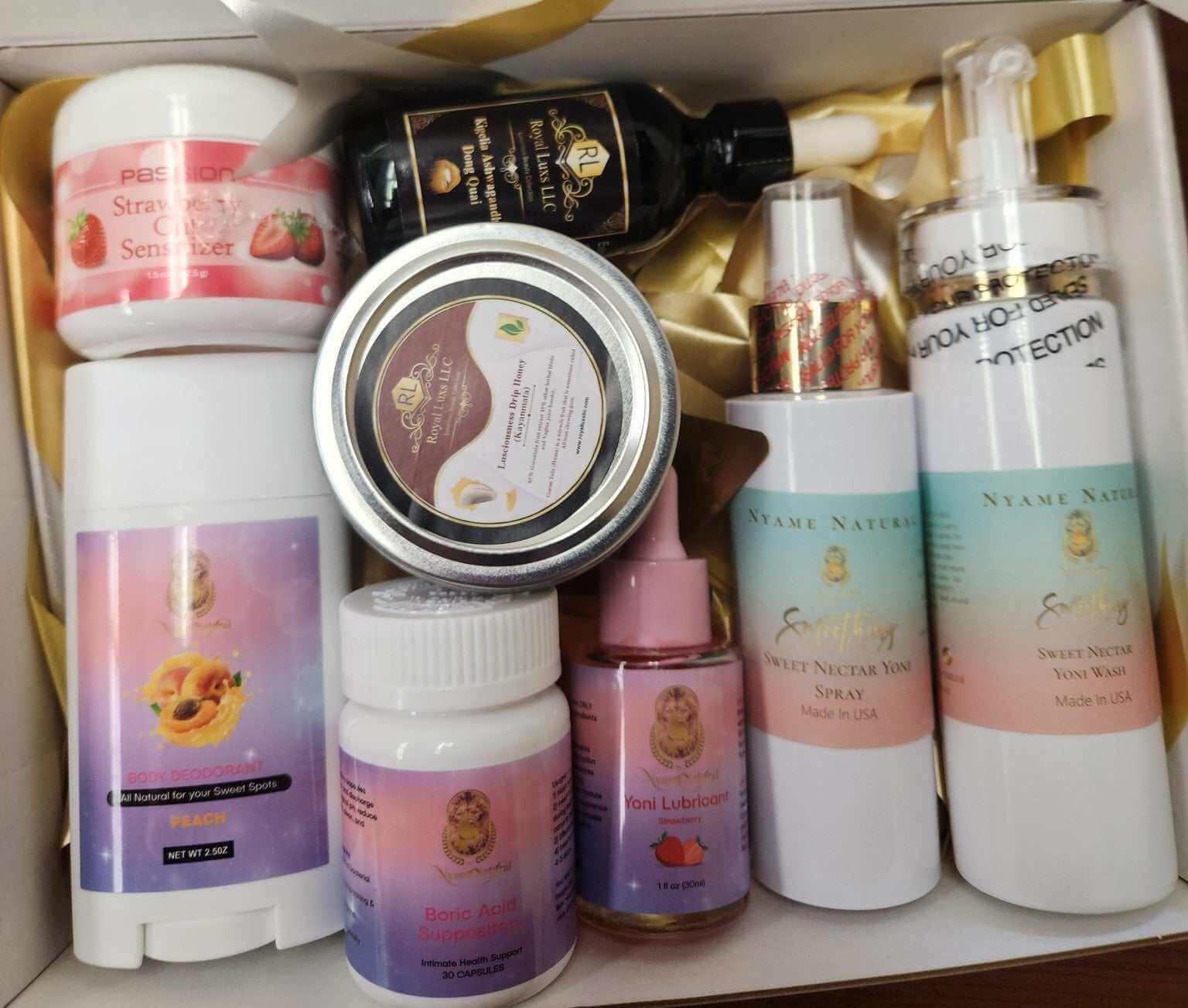 RoyalLuxsLLC herbal intimacy box containing body care products including sprays, lubricants, and creams