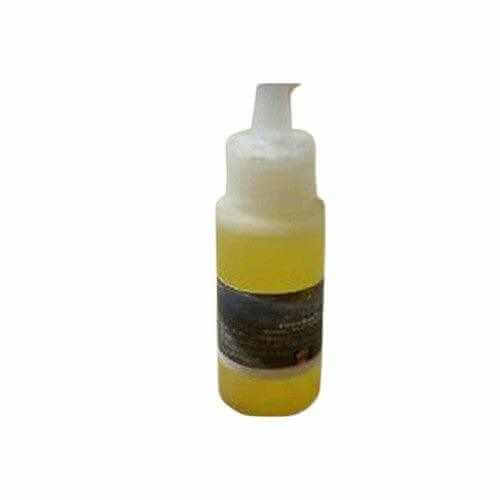Mandingo Miracle Oil for wellness in clear pump bottle with yellow oil for male enhancement