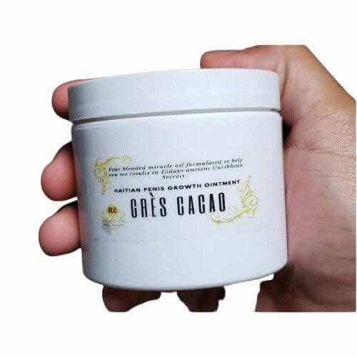 Haitian Gres Cacao growth ointment jar held in hand, designed for male enhancement and natural growth.